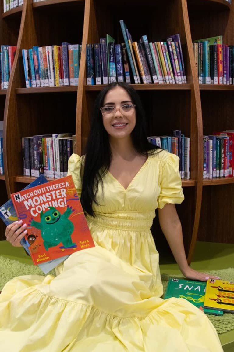 Nicole Dunkin reading to children